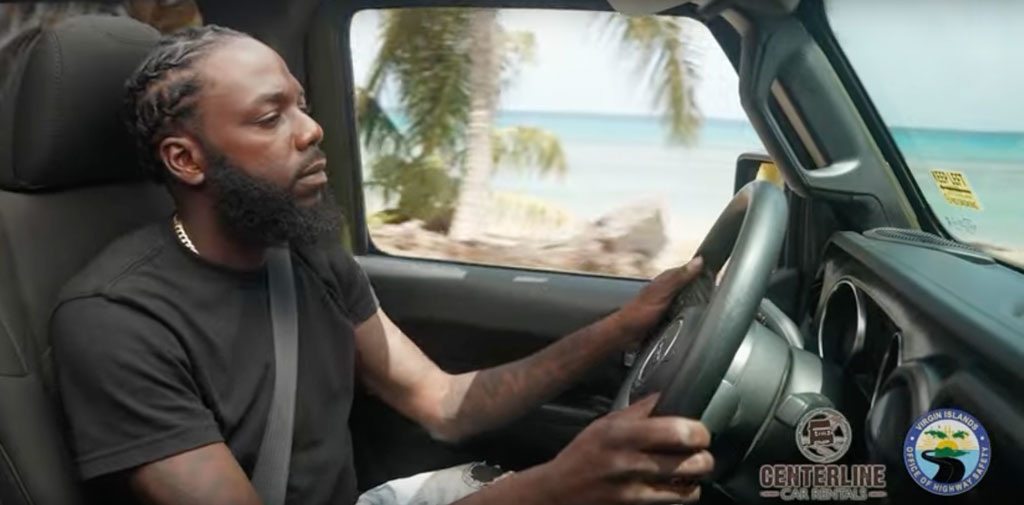 Man driving alongside the Caribbean Sea with no distractions