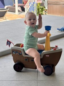 baby on toy pirate ship